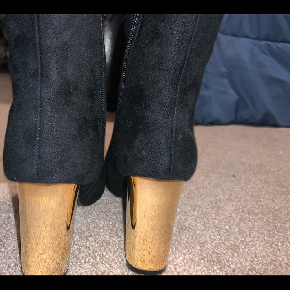 Black boots with gold heel